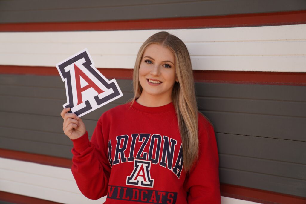 University of Arizona Female Student Holding a Foam Letter A